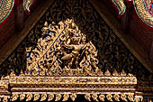 Bangkok Wat Arun - Detail of the gable of secodary entrance gate of the ubosot gallery. 